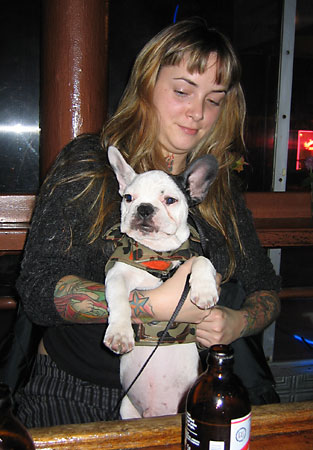 Tatt lady and bar dog